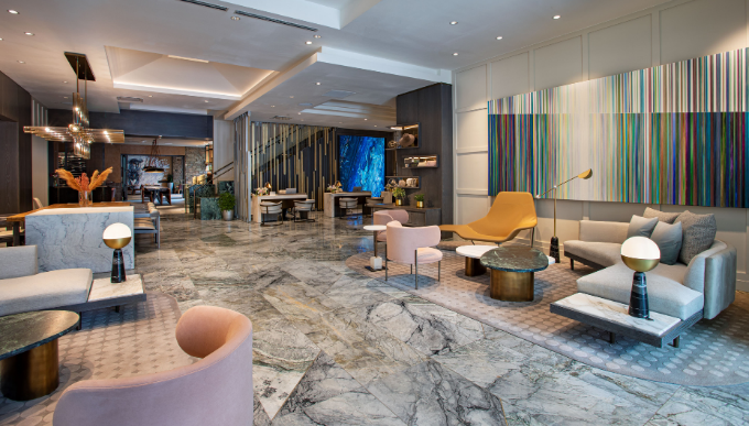 A modern hotel lobby with elegant marble flooring and stylish seating areas.