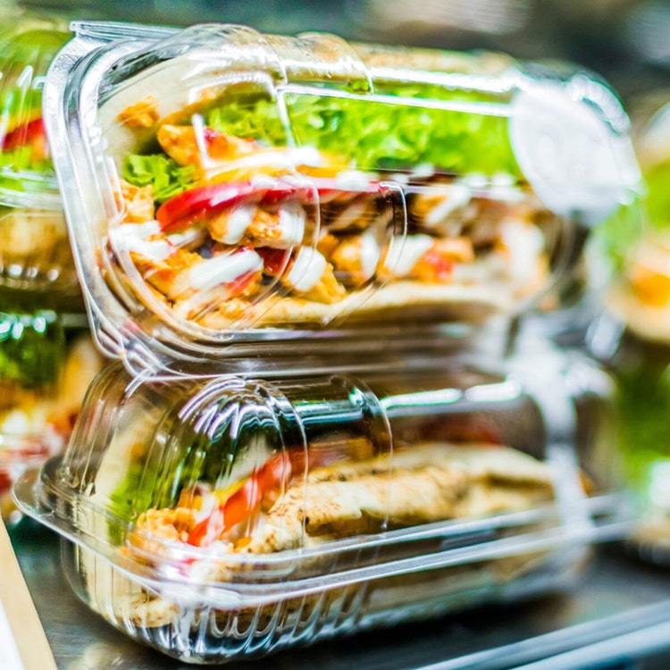 food displayed in plastic containers