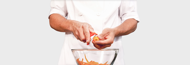 Chef peeling a carrot