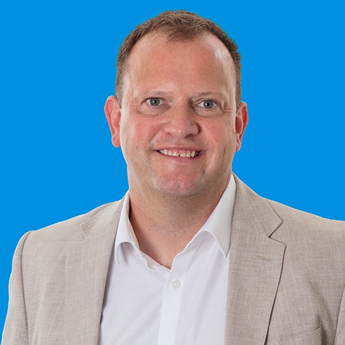 Ian Murphy picture with a blue background.