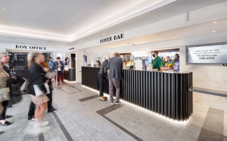 Spacious box office and foyer bar filled with people at Trafalgar THeatres, Picture