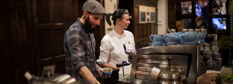 Caterers serving coffee