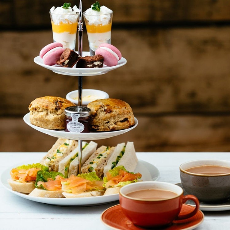 High tea tiered tray with two champagne glasses