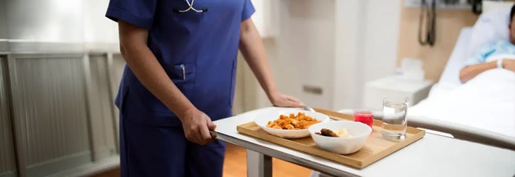 Nurse with food tray