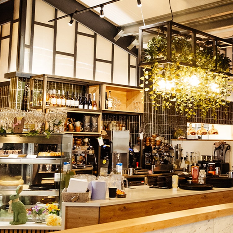 A restaurant featuring a stylish bar