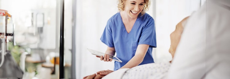 Nurse with patient and tablet