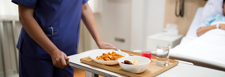 caterer serving food to patient