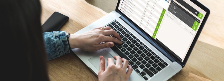 Woman using Pi system on laptop