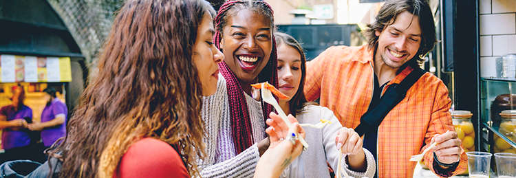 Group of customers sharing takeaway food for a social grab-and-go dining experience