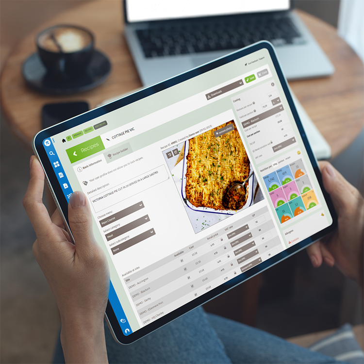 School catering menu planning software displaying recipe information, nutritional data and food costs on a tablet.