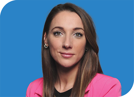 A professional headshot of May Limbach with a blue background