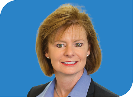 A professional headshot of Eleanor Waddell with a blue background