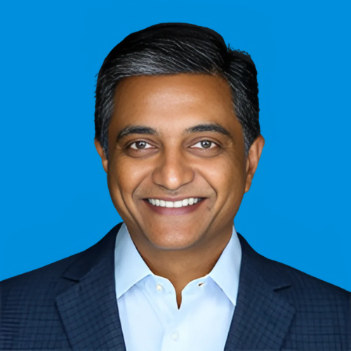 A professional headshot of Raju Sankuratri with a blue background