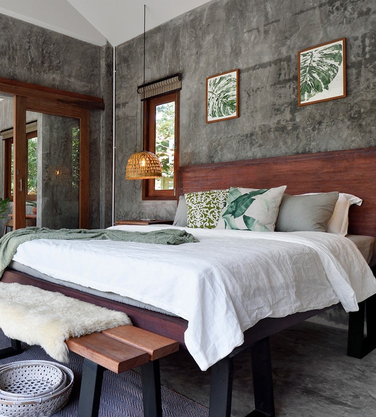 Luxury tropical resort bedroom with modern furnishings at an Avendra International property, hotel procurement