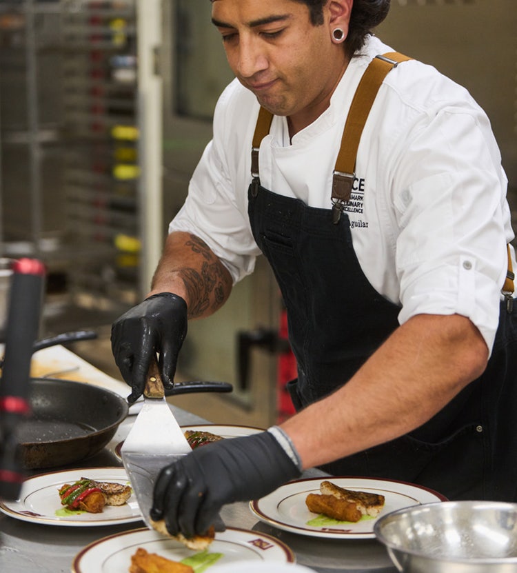 Chef preparing food at Avendra International, culinary expertise and hospitality services