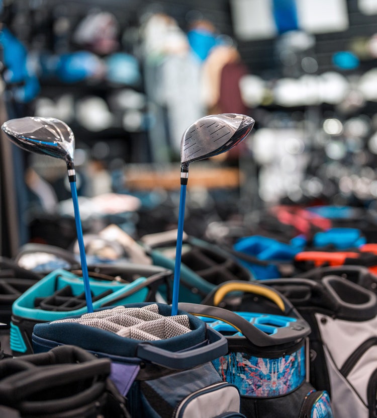 Vibrant golf equipment display in a modern retail store by Avendra International, procurement services