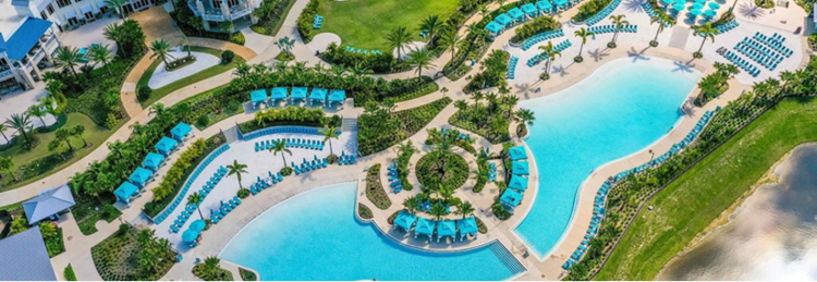 Aerial view of a resort with water feature