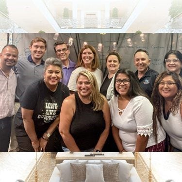 Group of Corporate Building Services Inc employees smiling