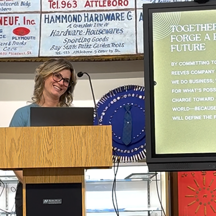 Woman speakign at podium