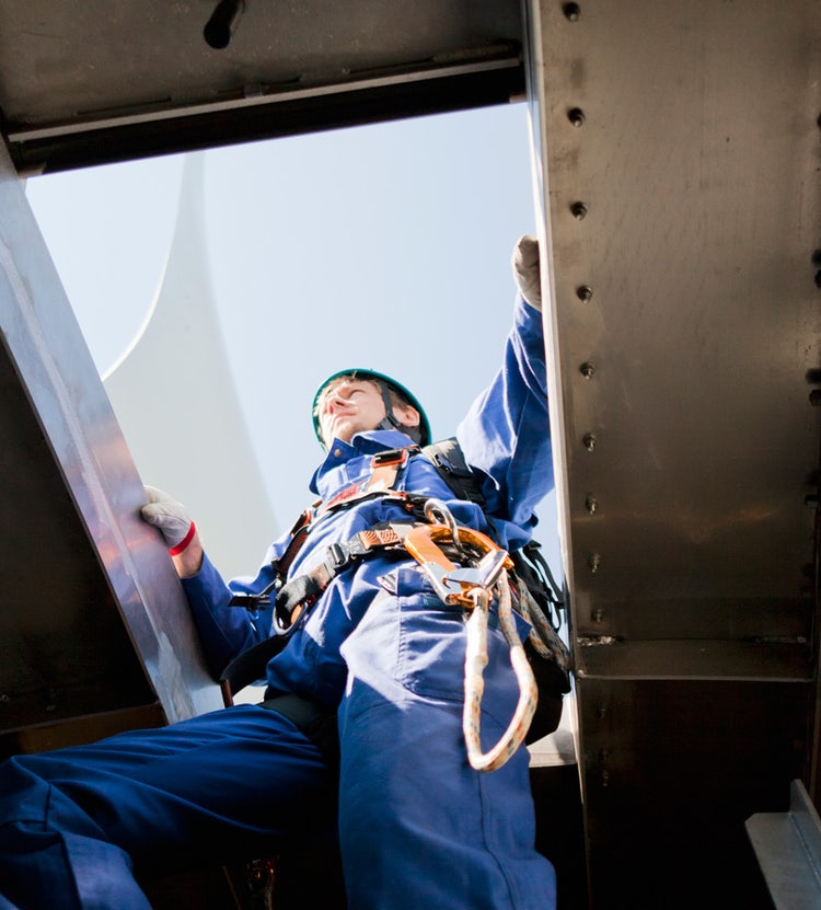 Man going through ceiling exit, highlighting Avendra International's expertise in maintenance and FF&E procurement solutions for the hospitality industry.